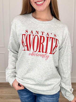 Grey crewneck sweatshirt with long sleeves and Santa's Favorite graphic on front