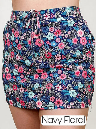 High-rise Avery Mae skort in navy floral print, drawstring waistband and tiered ruffle hem
