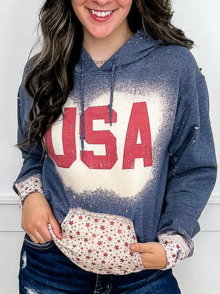 Blue hoodie sweatshirt with USA graphic and star-pattern front pocket