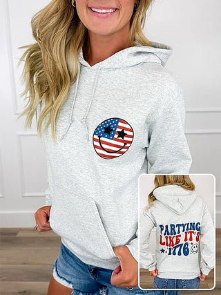 Grey long-sleeve graphic hoodie with circular American flag emblem on chest