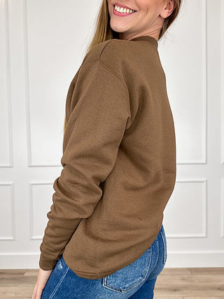 Brown crewneck long-sleeve sweatshirt, side view