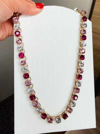 Pink and clear CZ tennis necklace with round bezel stones on gold-tone chain