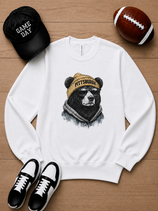 White long sleeve crewneck sweatshirt with Pittsburgh graphic dog wearing a grey hood and cap.