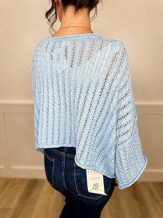 Blue knit long-sleeve cropped sweater top, round neck back view with vertical stripe texture