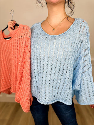 Blue knit long-sleeve cropped sweater top, round neck with textured vertical pattern