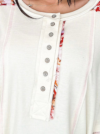 Cream short-sleeve rayon-blend top with button front and small chest pocket