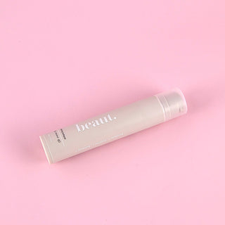 beaut. coconut whitening toothpaste tube with silver cap, angled view