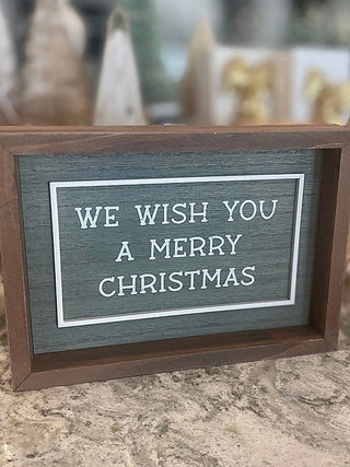 Reversible wood shelf sitter with teal sign: 'We Wish You a Merry Christmas'