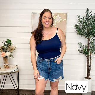 Navy padded cropped tank top with slim spaghetti straps and scoop neckline