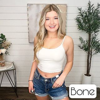 Bone padded cropped tank top with slim spaghetti straps and scoop neckline