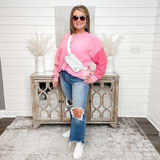 Medium-wash high-rise straight-leg cropped jeans with thigh rips and frayed cuffs.
