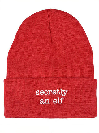 Red knit beanie with ribbed cuff and 'secretly an elf' embroidery