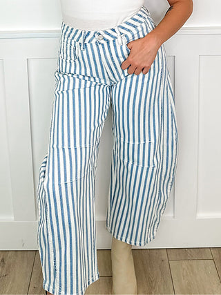 High-rise barrel-leg striped jeans in blue-and-white vertical stripes