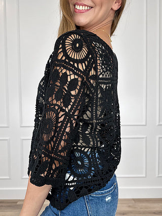 Black crochet short-sleeve top with circular lace pattern on side