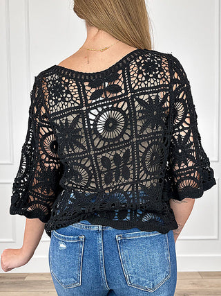 Black crochet short-sleeve top with open-back lace and circular motifs