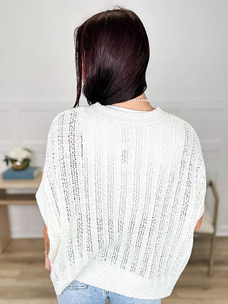 Cream knit short-sleeve sweater top, round neck, back view