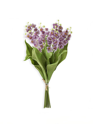 Purple floral decor bouquet with clustered blossoms and green leaves