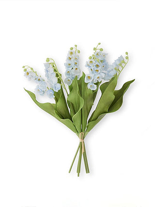 Blue and white floral decor bouquet with clustered blossoms and green leaves