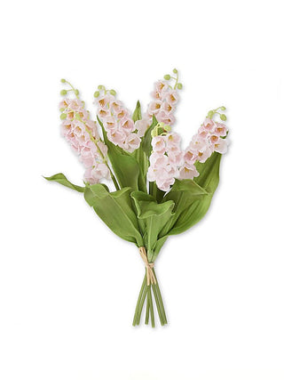 Pink floral decor bouquet with clustered blossoms and green leaves