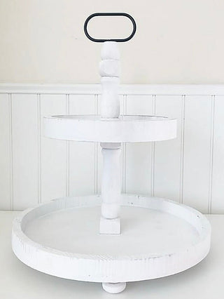 White wooden tiered tray with round base, central column, and top handle
