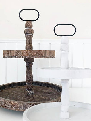Brown wood two-tier tray stand with turned spindle and oval handle tops