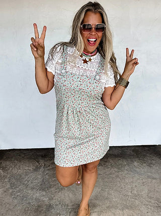 Cream floral overall dress with white lace yoke and short sleeves