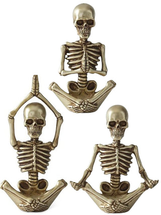 Gold-tone resin skeleton decor set of three figures with skull and ribcage poses