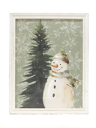 White wood sign with snowman and pine tree in winter scene