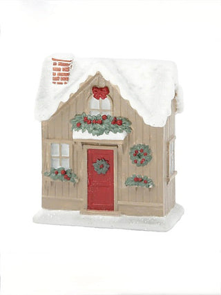 Taupe snowy cottage resin house decor with red door, greenery wreaths, and white roof snow