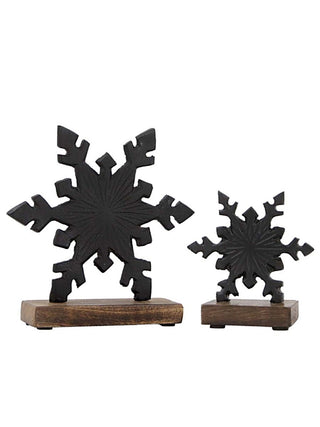 Black metal snowflake decor set with two snowflakes on wooden bases