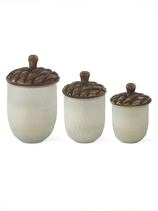 Candle jar set with three white ceramic containers and brown textured lids