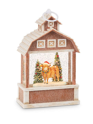 Brown decorative water lantern with cabin scene, trees, and animal figure