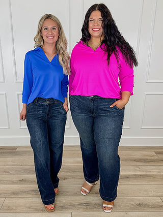 3/4 sleeve top and wide-leg jeans outfit with heeled sandals; blue and fuchsia tops