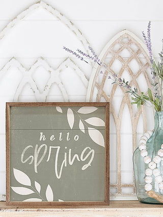 Hello Spring green wood sign with leaf design and cursive text