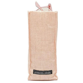 Pink fabric glasses holder with glasses peeking out and "LOOKING GOOD" label