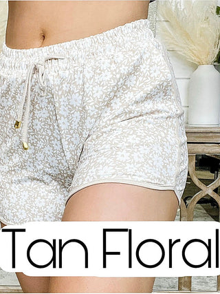 Tan floral high-rise shorts with elastic waist and drawstring, side pockets