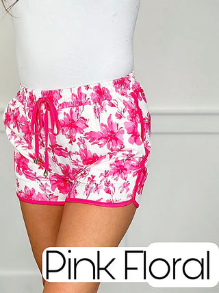 Pink floral high-rise shorts with elastic waist and drawstring ties