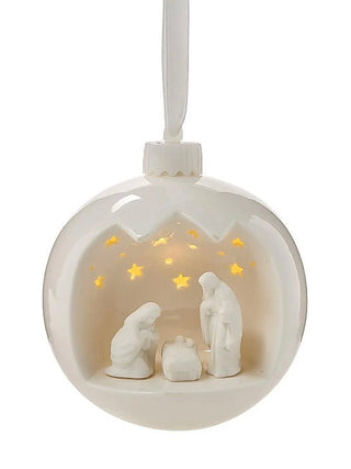White porcelain nativity scene light-up ornament with hanging loop and glowing star accents