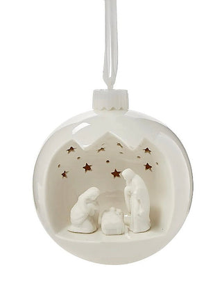 White porcelain nativity scene light-up ornament with glowing star cutouts and nativity figures