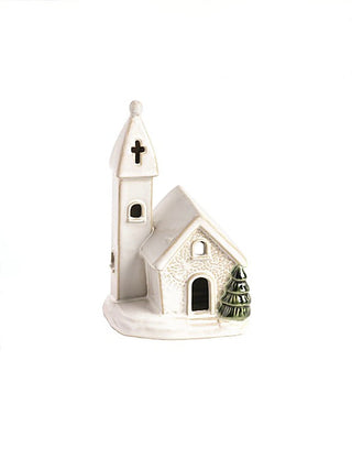 Ceramic church house decor with green pine trees and cross accents
