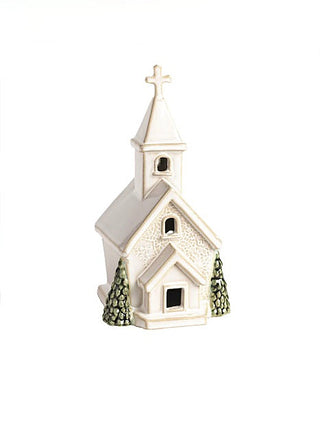 Ceramic church house decor with textured white facade and green pine trees