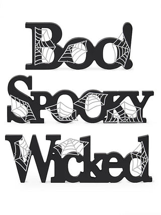 Black wood letter decor set spelling Boo, Spooky, and Wicked with web patterns
