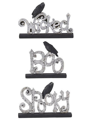 Resin word decor set with silver glitter letters, black bat accents, and dark base pieces