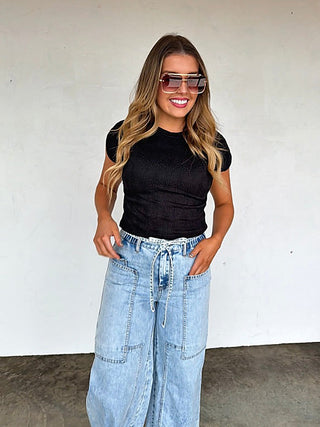 Black lightweight cropped short-sleeve crew-neck top with subtle textured pattern