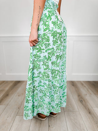Green and white leaf-print rayon maxi skirt, side view with flowing tiered hem