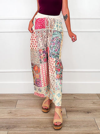 High-rise wide-leg patchwork patterned pants, multicolor medallion print.