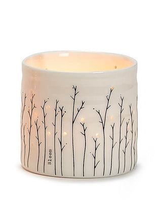 Porcelain candle holder with tree-branch design and 'Bloom' text