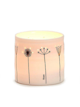 Porcelain candle holder with dandelion stems and 'Home' text