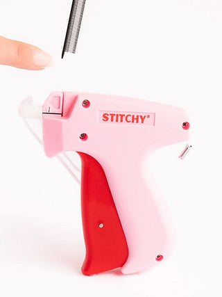 Pink STITCHY refill stapler-style sewing tool with red handle