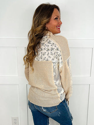 Tan knit long-sleeve button-up top with patchwork print and chest pocket detail